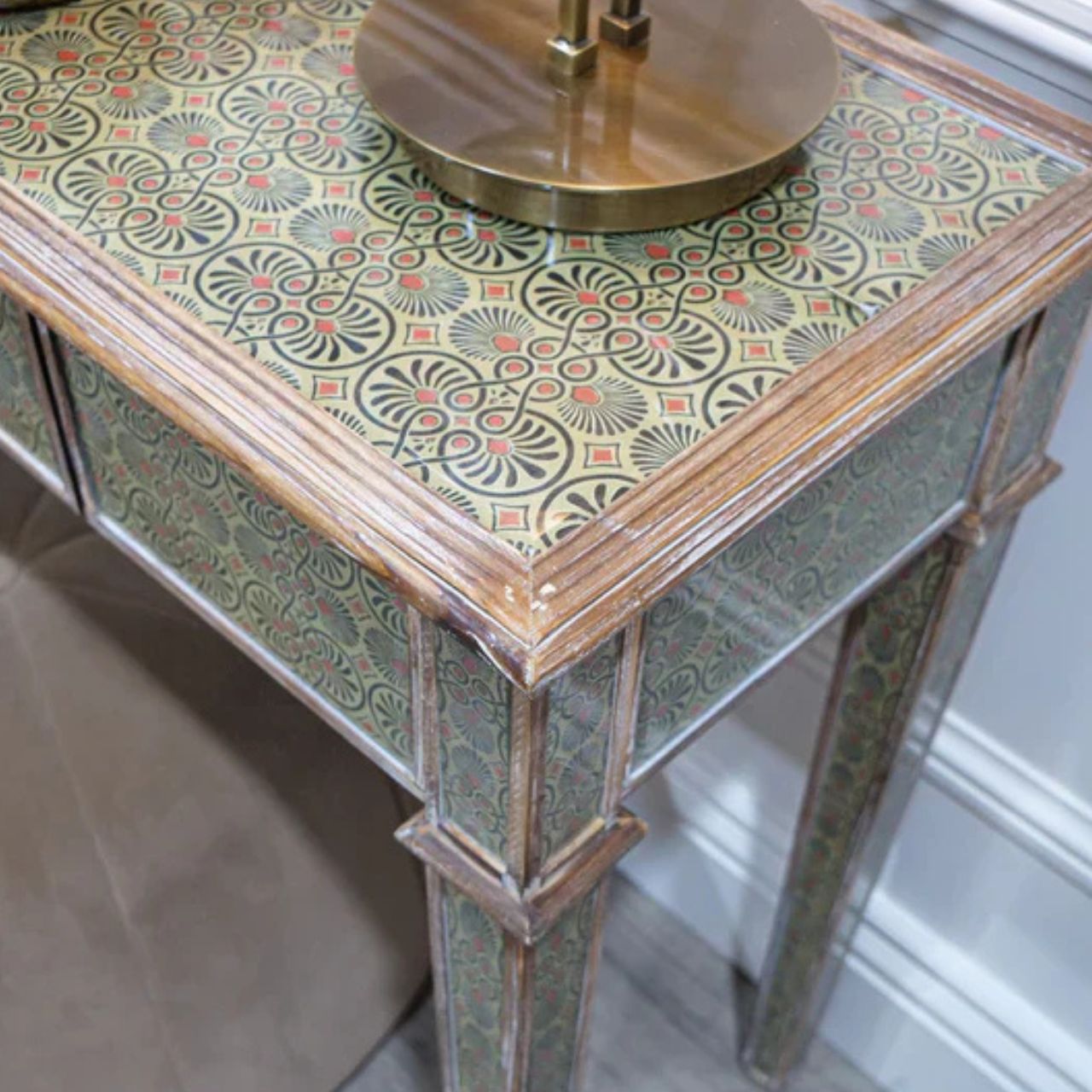 A striking 1960s retro-inspired console table with a draw for storage. A stunning vine-like detailing is used on the handles and instantly adds a sense of intrigue and life.