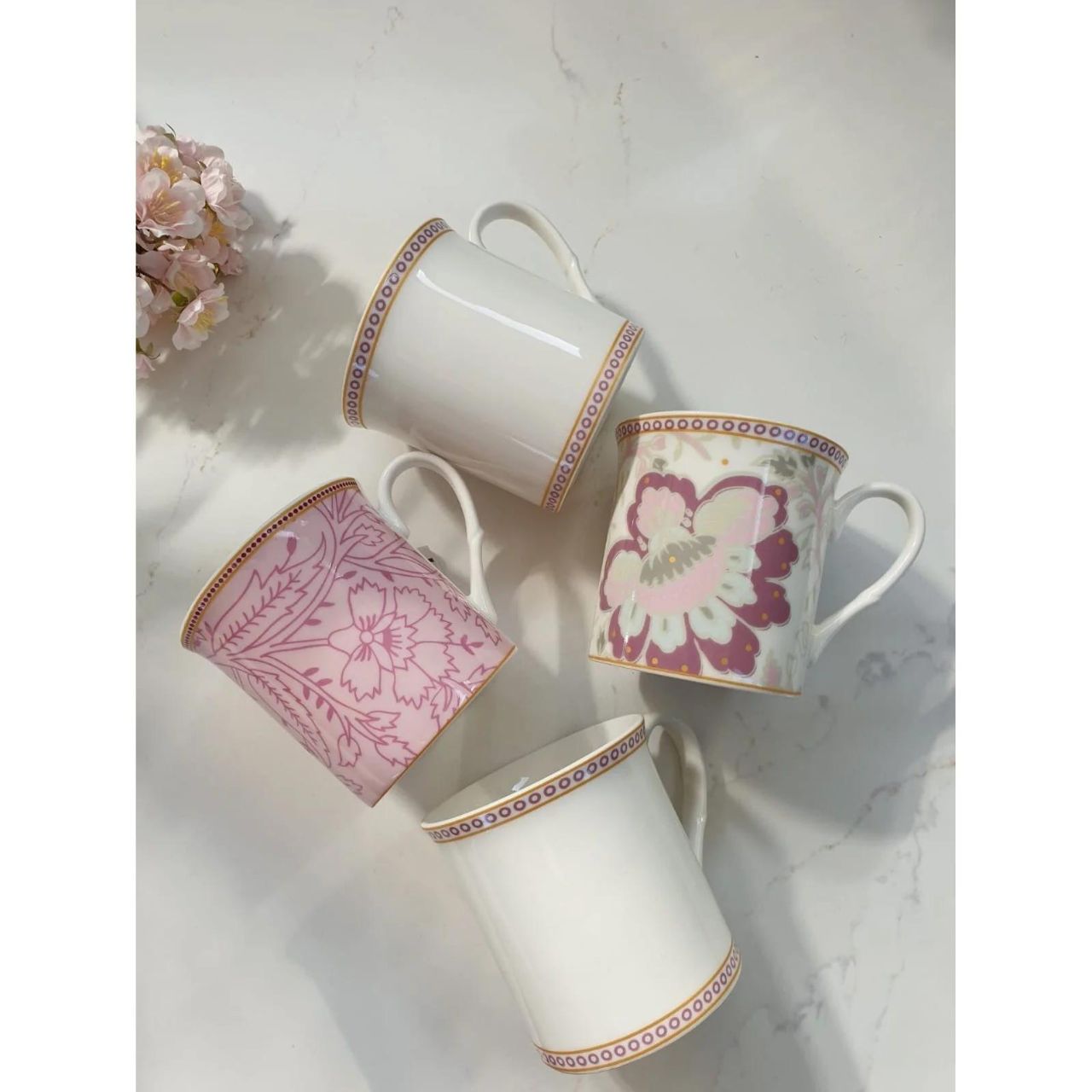 Azalee Cups Set of 6 by Mindy Brownes  This set of 6 Mindy Brownes Cups is the perfect gift for any special occasion or a gorgeous addition to your own home! Expertly crafted from new bone china and is both dishwasher and microwave-safe.