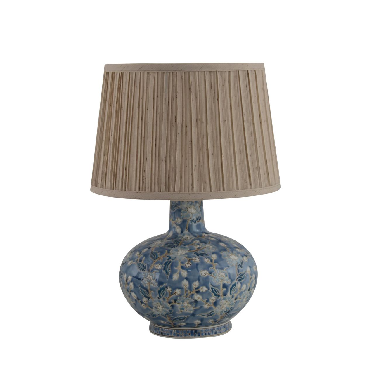 The Cleo Lamp brings timeless elegance with its blue floral ceramic base and softly pleated shade. The intricate pattern adds depth and character, while the neutral shade diffuses a warm, inviting glow, perfect for creating a relaxed atmosphere.