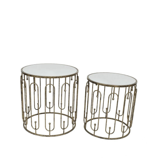 Two is always better than one. A beautiful set of two side tables that neatly stack on top of each other. Circular in design with oblong detailing on the outer surround. Finished with a mirrored top and distressed antique gold.