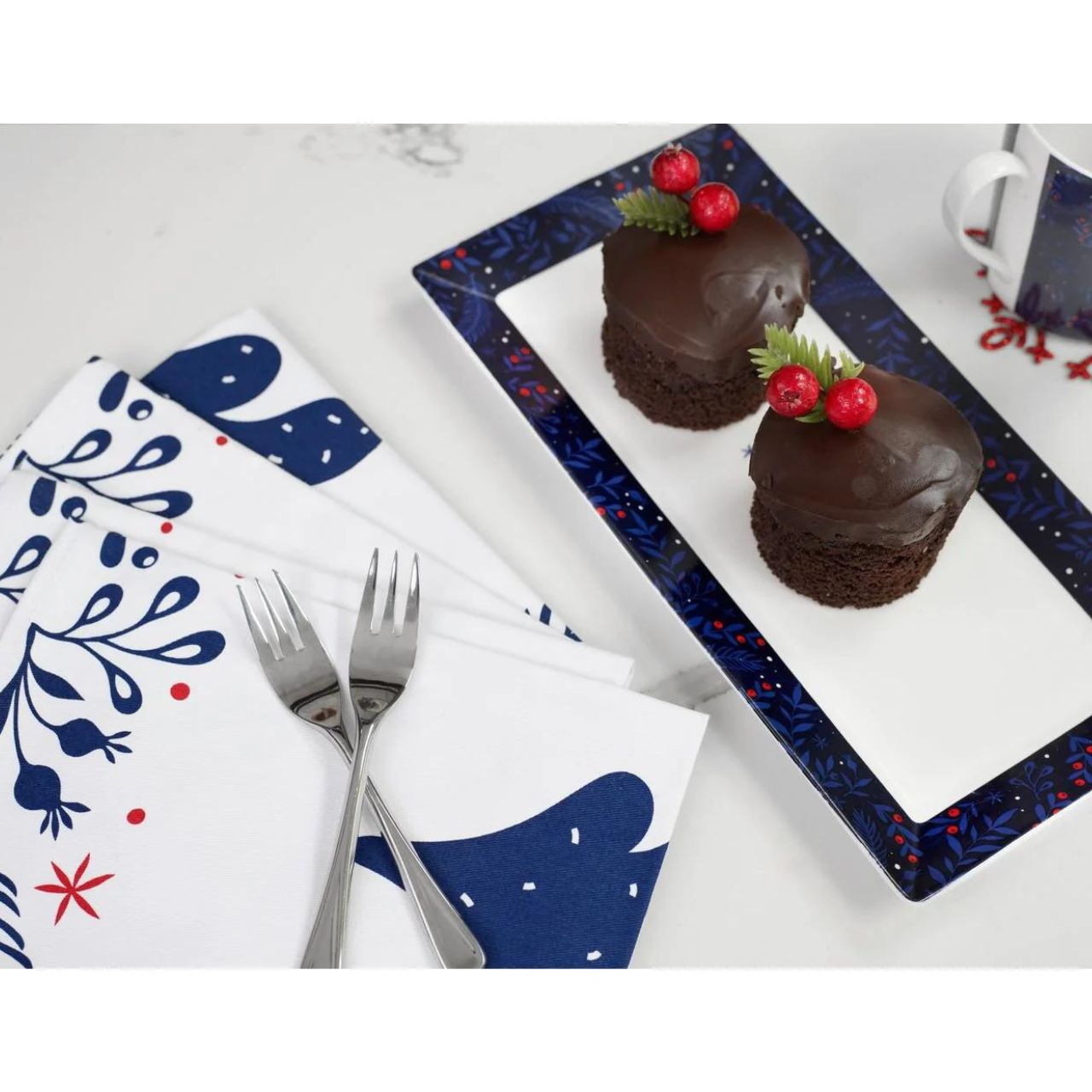 Midnight Blue Christmas Platter Set of 2 by Mindy Brownes  Introducing our set of two Christmas platters. Rectangular in design these plates have a simple yet festive pattern and curved rim for stylish serving of cakes, cookies, and more.