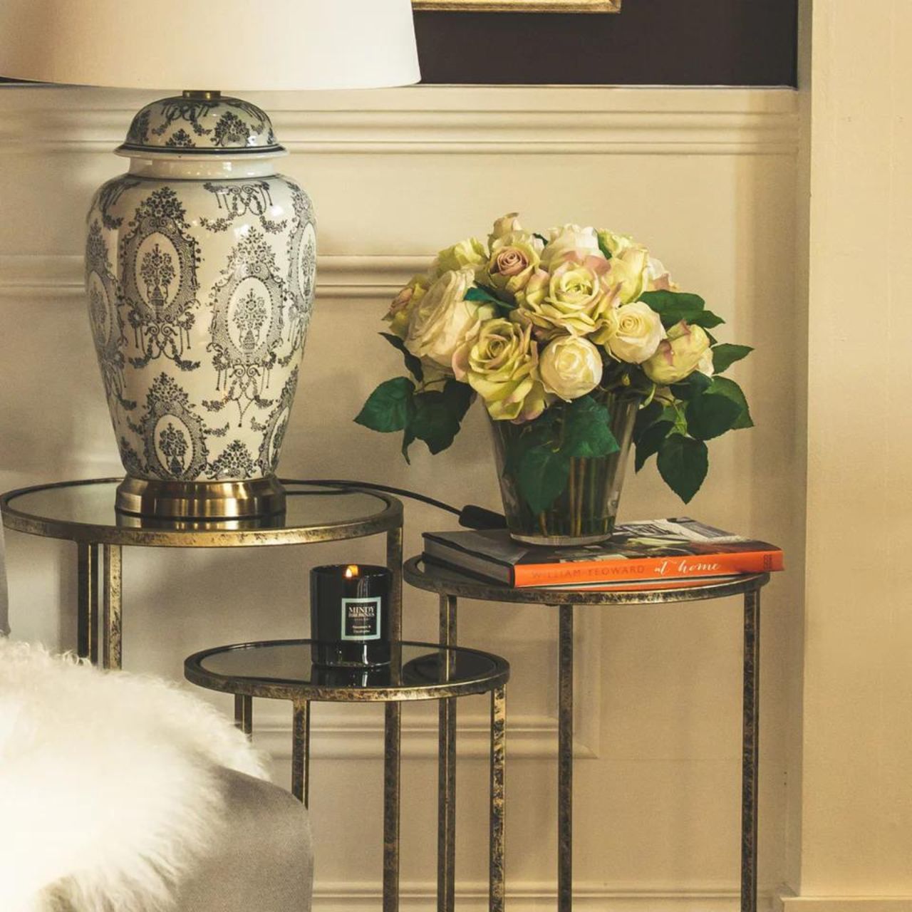 Mindy Brownes Mirror Top Nest of Tables Set of 3  Three Pod Tables that neatly stack on top of one another. Champagne gold colour in finish and a mirror top. A beautiful addition to any home. These tables only stack on top of one another, or side by side, underneath bars should not be crossed. 