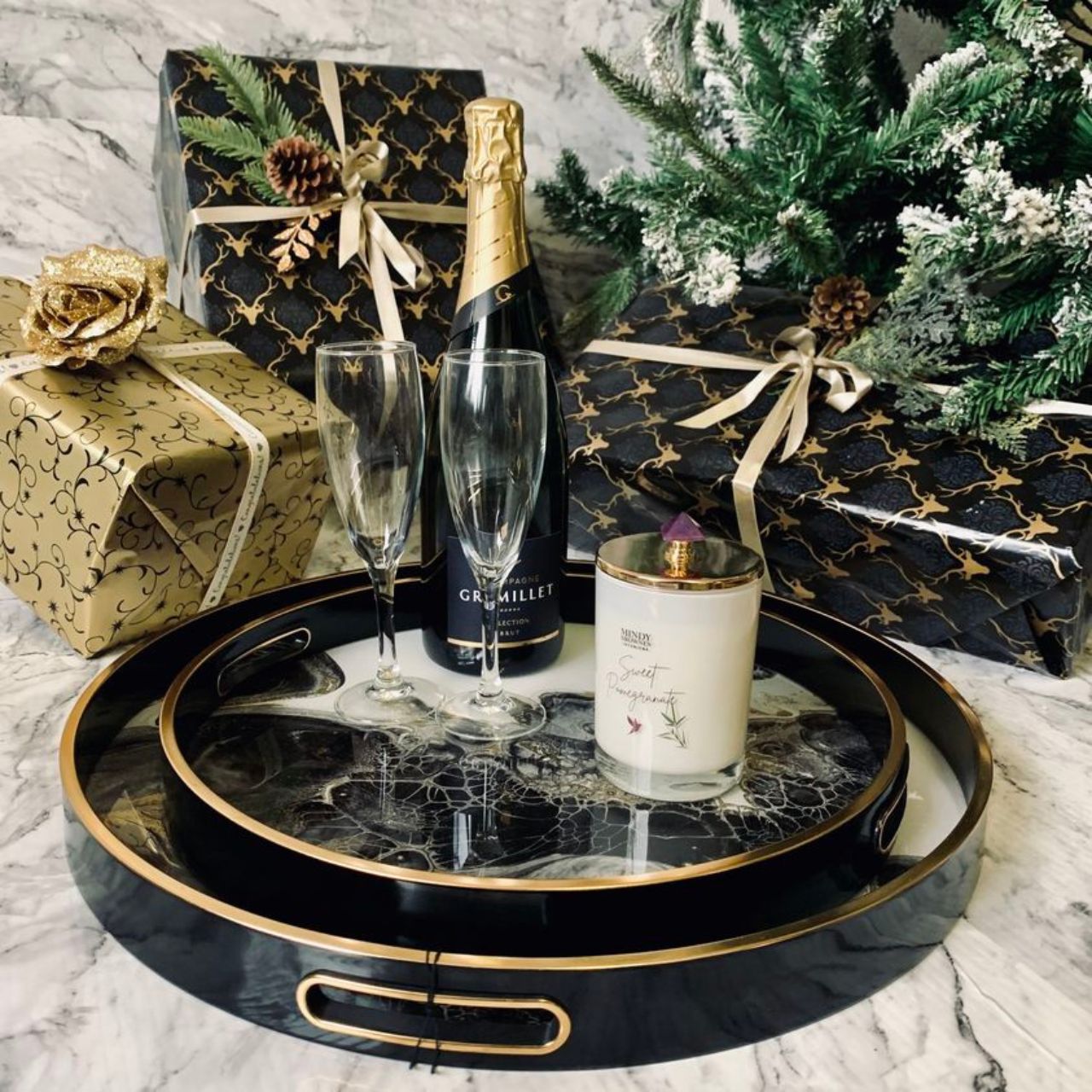 Mindy Brownes Serving Tray Sunrise Set of 2   Set of two trays. Black, grey and white in colour with gold detail rim. Ideal for shelf styling, coffee table styling, dining area and living space. Beautiful filled with glassware and bar essentials on a drinks trolley or bar cabinet.