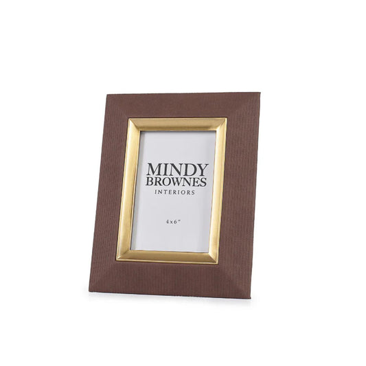 The Sutera Picture Frame in Brown 4 x 6 boasts a classic and elegant design with gold accents. The perfect way to preserve and showcase your memories, this photo frame adds a touch of sophistication to any room. Timeless and versatile, it complements a variety of décor styles.