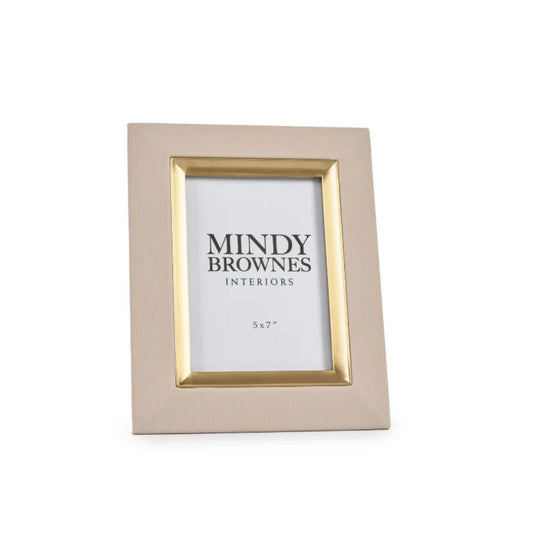 The Sutera Picture Frame in Cream presents a luxurious touch to your cherished memories. Its elegant design with gold detail elevates the beauty of your favourite 5 x 7 photo. Crafted with top-quality materials, it adds a touch of sophistication to any space. Display your special moments with style.