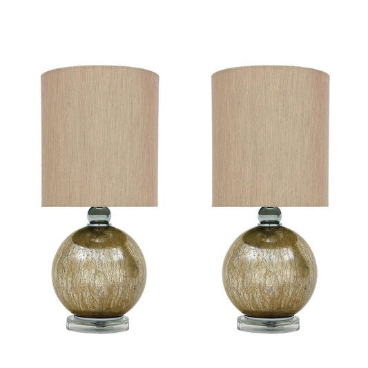 Mindy Brownes Interiors table lamp, set of 2. Mercury glass in champagne gold finish and crystal base. Shade is taupe and sheen in finish. Perfect as a set of bedside lamps or styled in your living room.