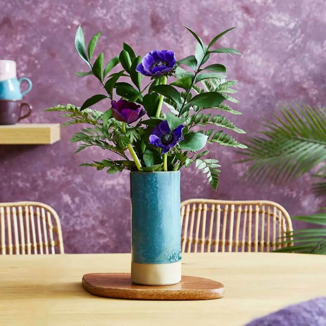 A beautiful vase featuring a captivating teal glaze