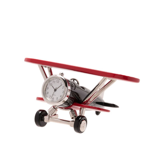 The red and black metal clock showcases a fantastic bi-plane design which displays great attention to detail. On the front of the plane sits a miniature Arabic clock face.