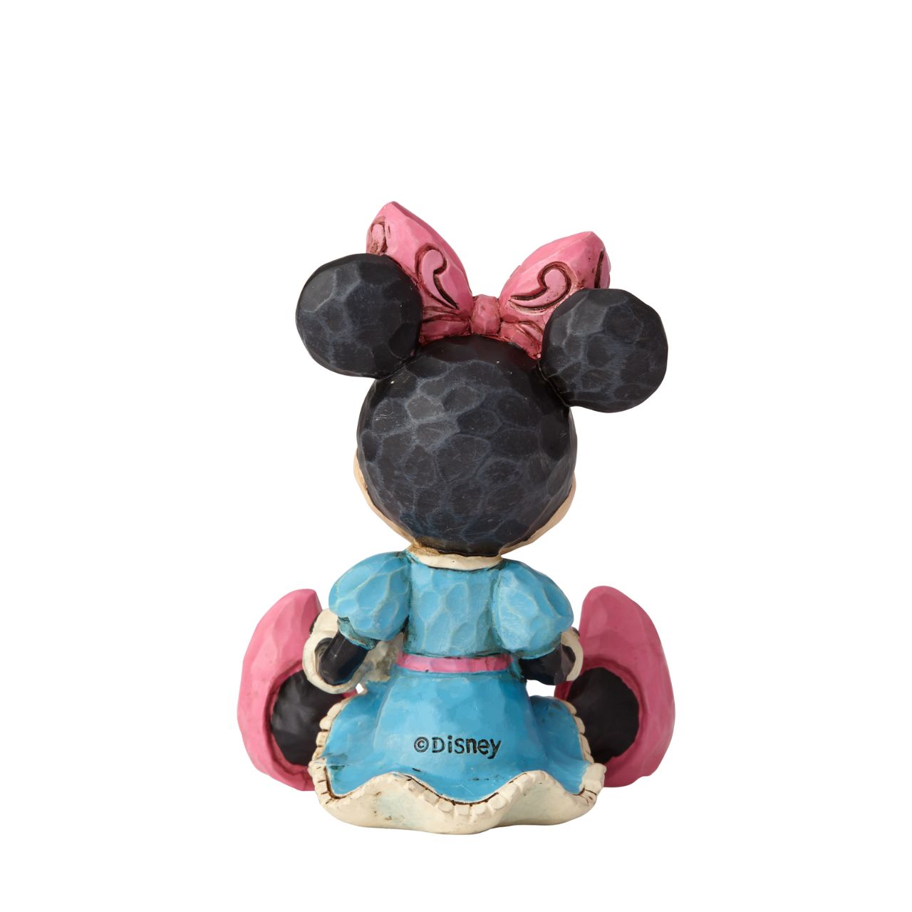 Disney Showcase Minnie Mouse with Heart Mini Figurine  Beautifully handcrafted with delightful attention to detail, Jim Shore's charming miniatures capture the essence of the beloved Disney characters. Making a wish on a heart held close, this beguiling Minnie is a heartfelt and playful romantic design.