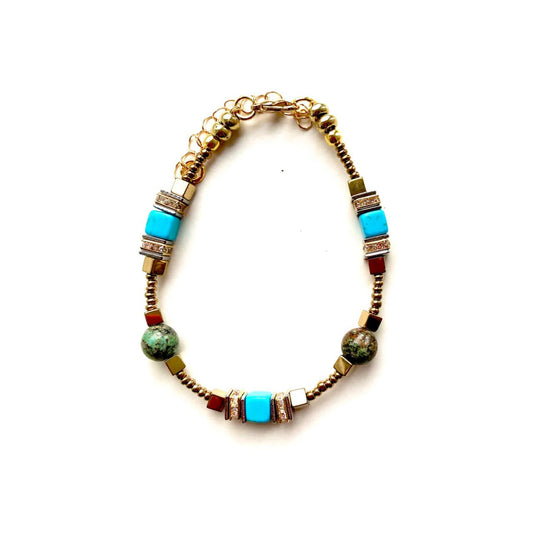 I love playing around with geometric shapes. &nbsp;Here I have combined cubes and spheres for a dynamic effect using African Turquoise, turquoise coloured Howlite and Hematite gemstones interspersed with sparkling Rhinestone spacer beads, creating an easy to wear and flattering piece of jewellery.