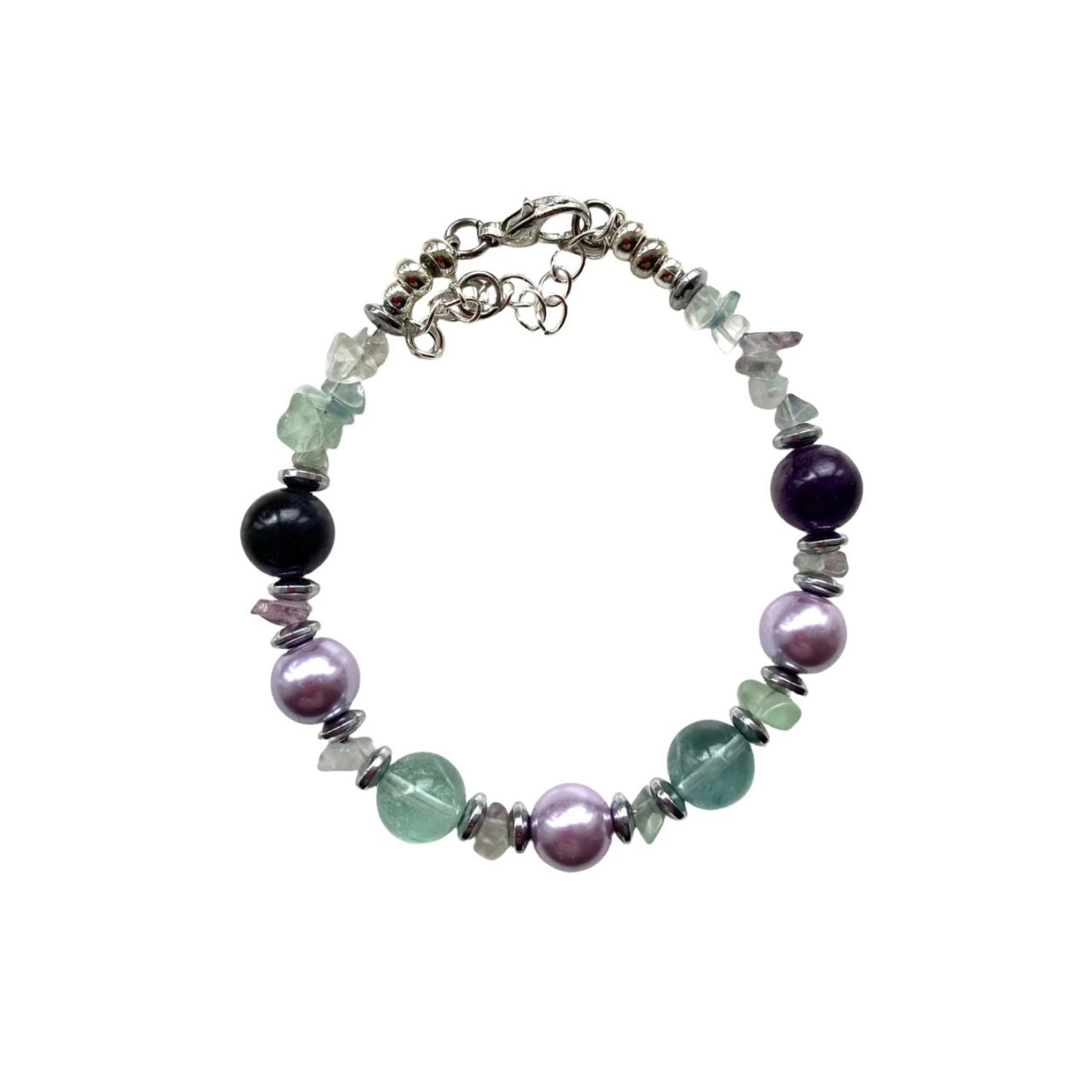 In this bracelet we have green and purple Flourite gemstone chips and round beads combined with lilac Glass Pearls and silver plated Hematite gemstone rondelles.