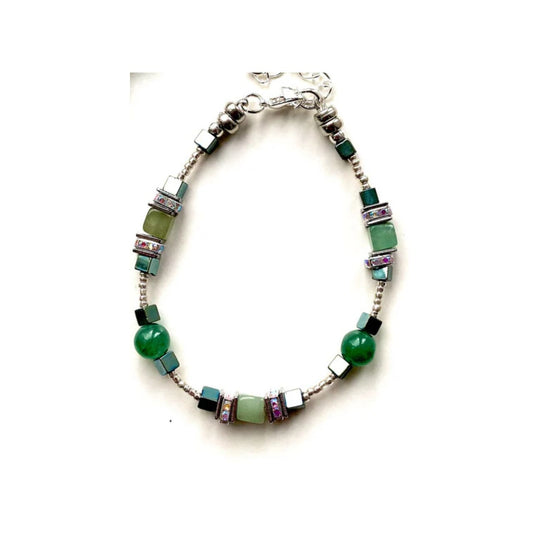 I love playing around with geometric shapes. Here I have combined cubes and spheres for a dynamic effect using Green Aventurine, Jade and Hematite gemstones interspersed with sparkling Rhinestone spacer beads, creating an easy to wear and flattering piece of jewellery.