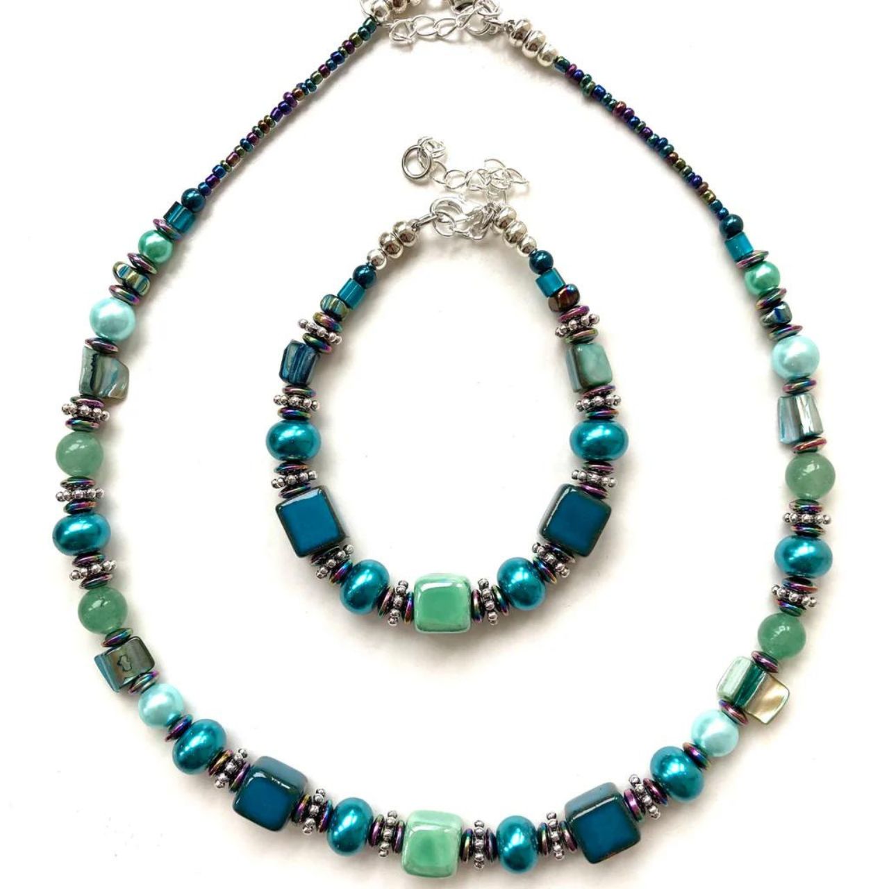Necklace with blue/green Ceramic cubes, Amazonite and Hematite gemstones and blue/green natural shell beads. Length: approximately 16 inches (40cms) with a 2 inch (5 cm) extension chain.