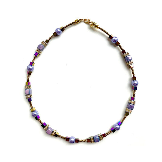 Combined cubes and spheres for a dynamic effect using lilac coloured Ceramic cubes and gold plated Hematite gemstones teamed with toning Pearls, all interspersed with sparkling Rhinestone spacer beads, creating an easy to wear and flattering piece of jewellery.