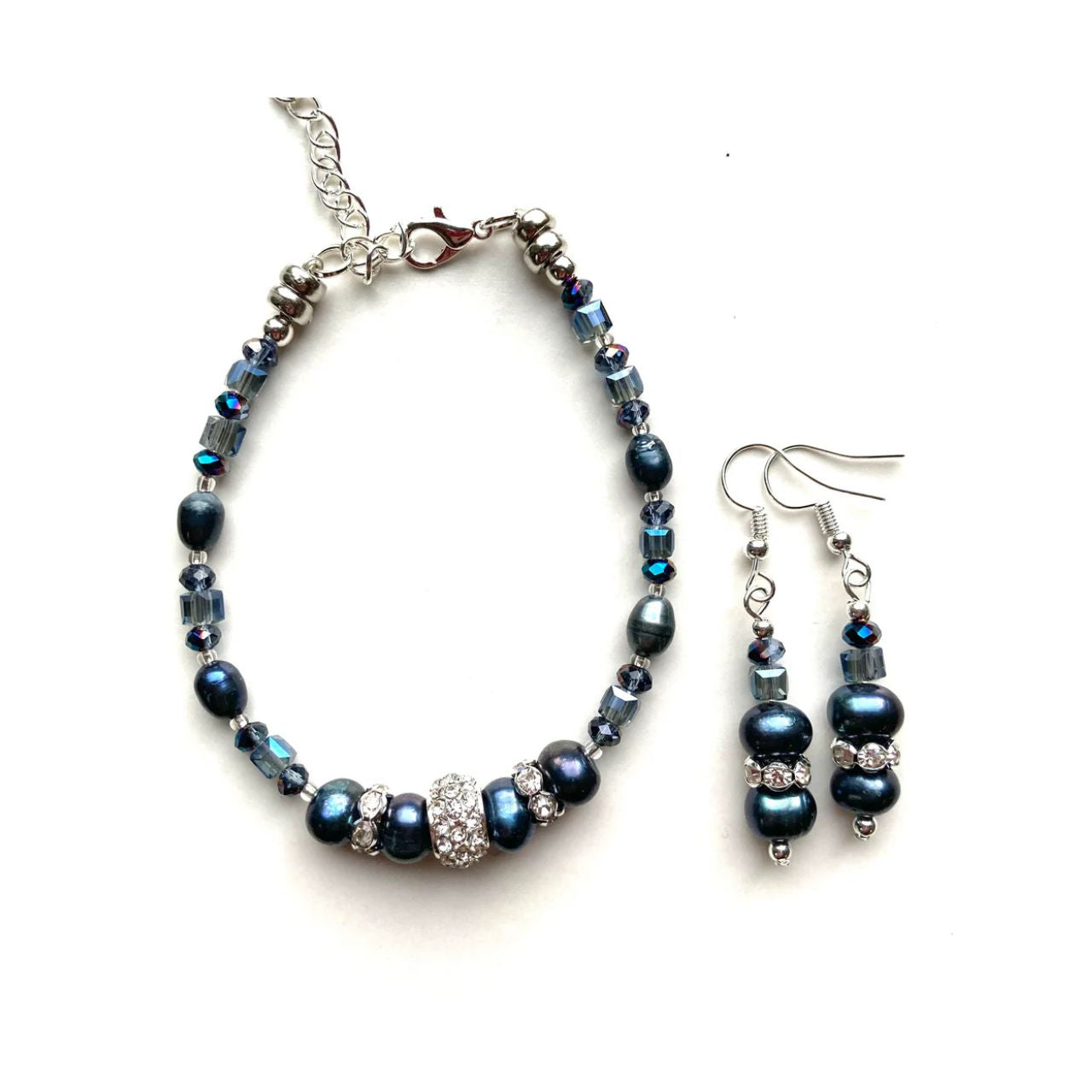 These freshwater pearls have an unsurpassed natural beauty. Their deep blue colour is complemented by little faceted blue Crystal rondelles and cubes and highlighted by elegant cubic zirconia-studded silver collars.