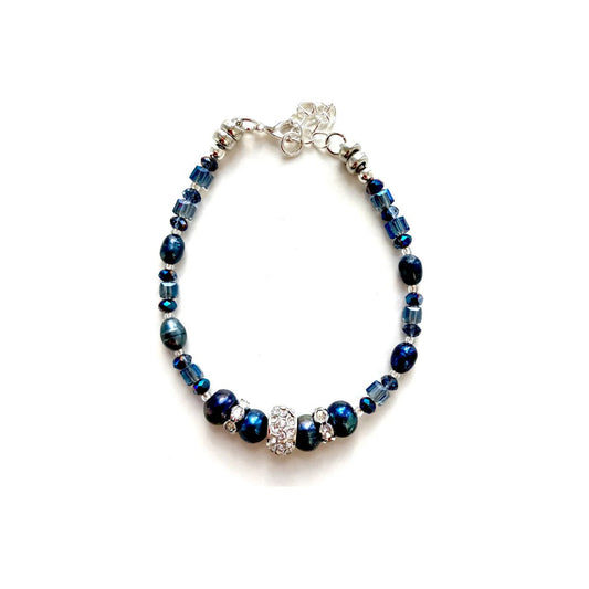 These freshwater pearls have an unsurpassed natural beauty. Their deep blue colour is complemented by little faceted blue Crystal rondelles and cubes and highlighted by elegant cubic zirconia-studded silver collars.