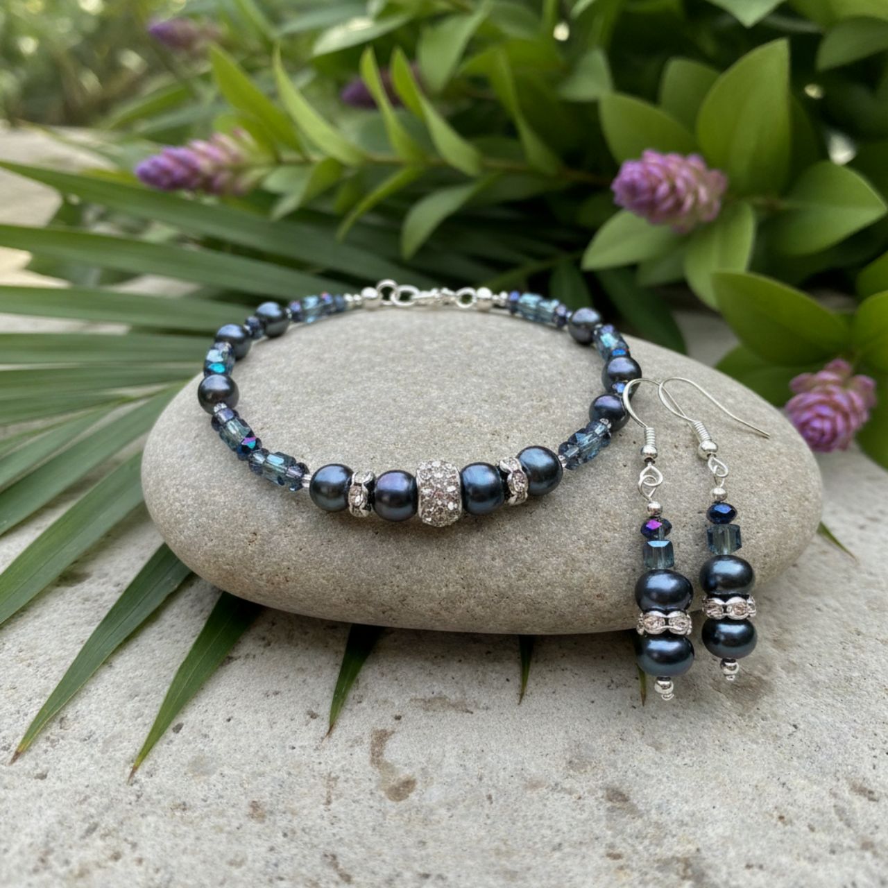 These freshwater Pearls have an unsurpassed natural beauty. Their deep blue colour is complemented by little faceted blue Crystal rondelles and cubes and highlighted by elegant cubic zirconia-studded silver collars.