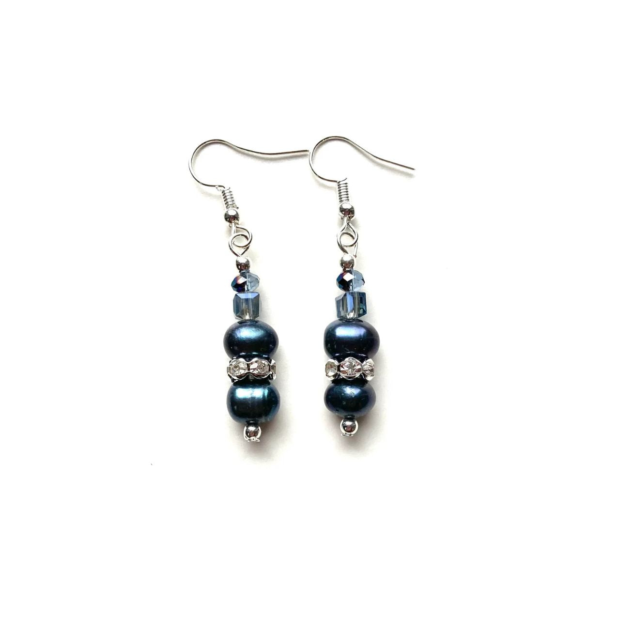 These freshwater Pearls have an unsurpassed natural beauty. Their deep blue colour is complemented by little faceted blue Crystal rondelles and cubes and highlighted by elegant cubic zirconia-studded silver collars.