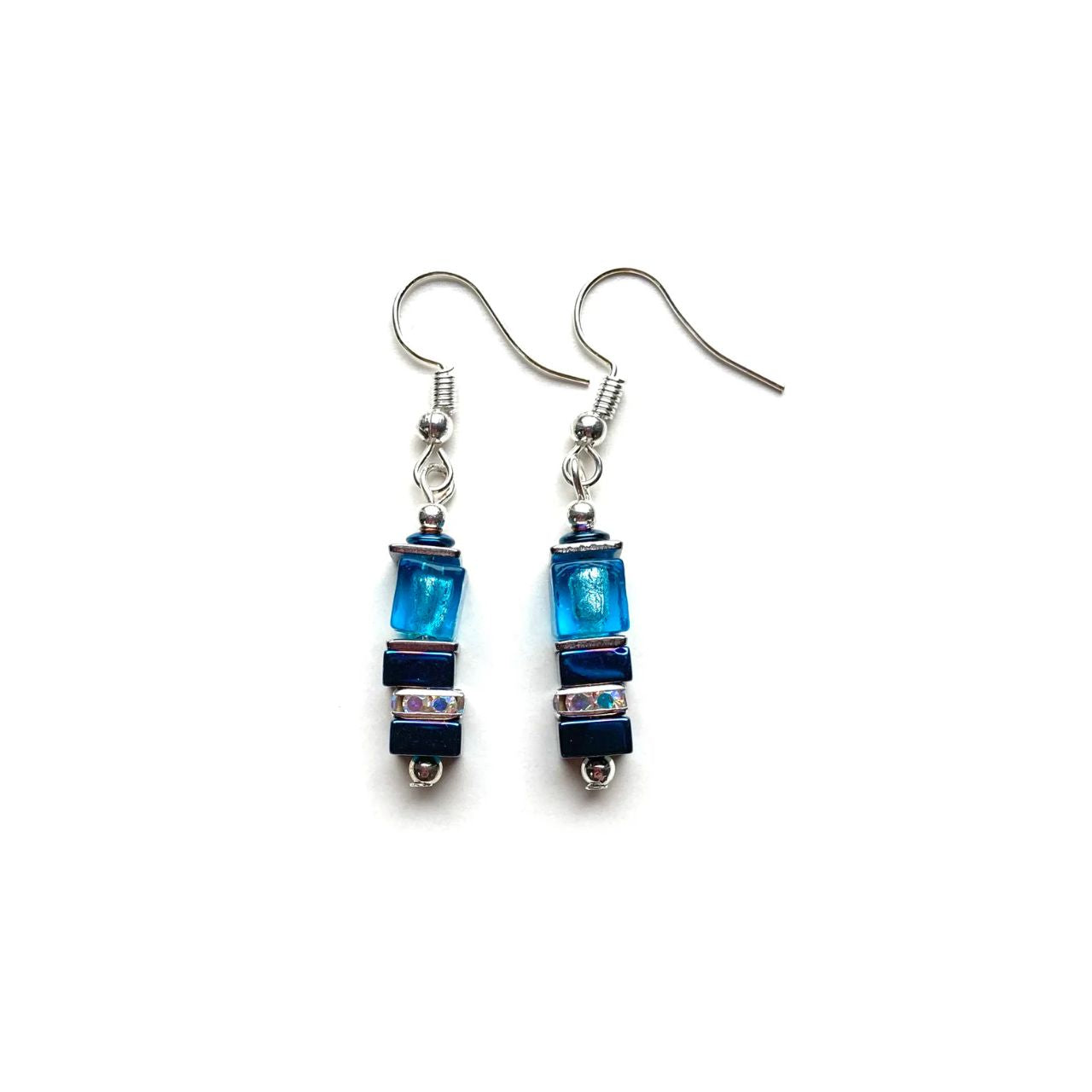These earrings comes with silver-lined Murano-style glass cubes in ocean blue complemented by Hematite gemstone squares in marine blue with the added sparkle of silver Rhinestone spacer beads.