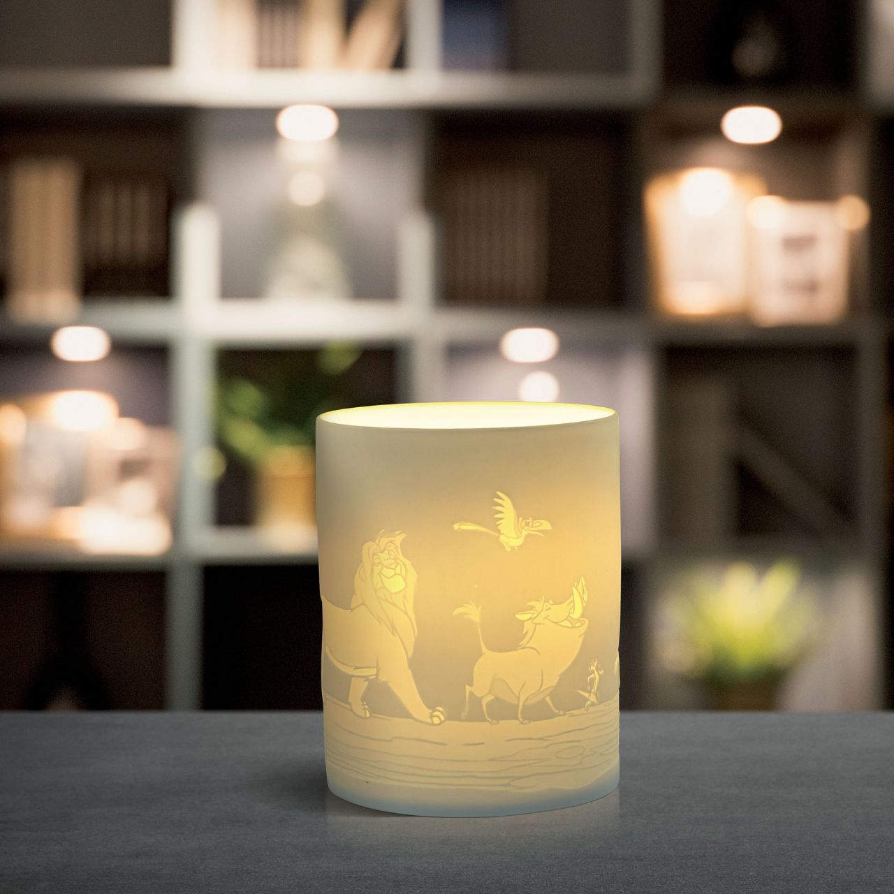 Simba, Timon, Pumba and Zazu will seem as if they are growing up right before your eyes when you light the LED candle, and as they flicker across your room. The Lion King characters are etched into the thin translucent porcelain which radiates a warm night light.