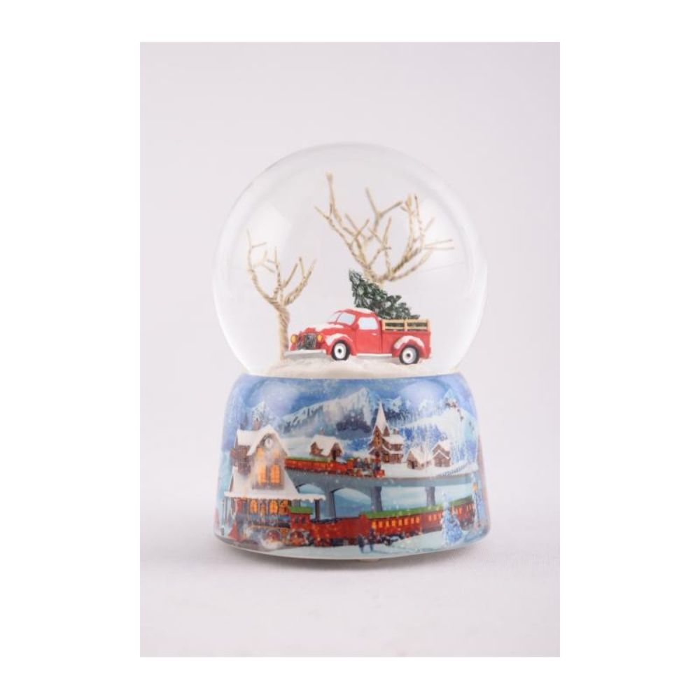 Glitter globe 120 mm. The train turn around the globe and Santa fly above the houses while the melody “Jingle Bells” plays.