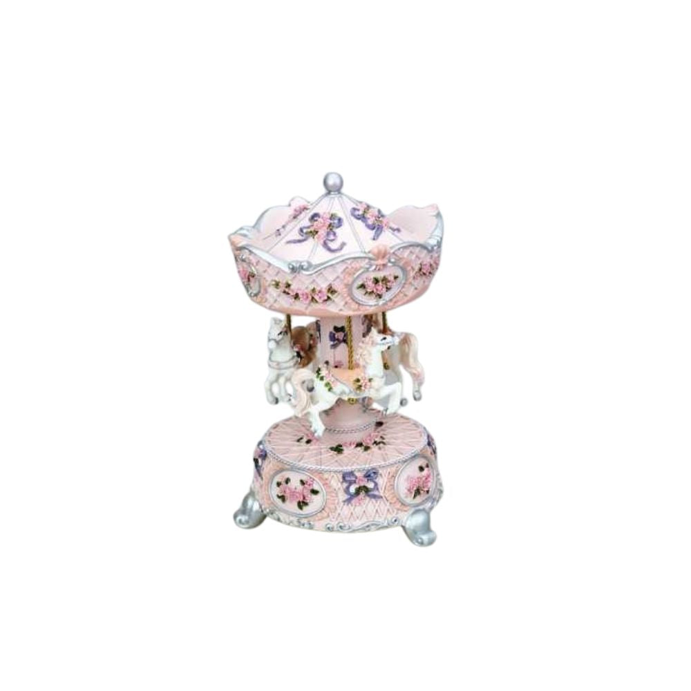 Rose carousel decorated with rose roses and pink ribbon turns to the melody Bolero.