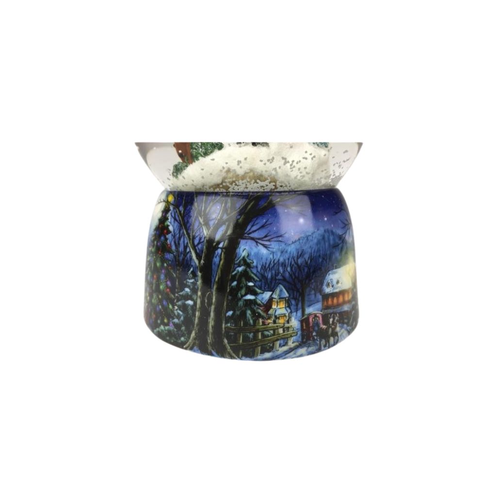 Snow globe sleigh ride. In the globe filled with snow, a couple takes a nostalgic sleigh ride past a snow-covered church surrounded by fir-trees. The base is painted with snowy village scenes. By winding the musical mechanism up, the scene starts to rotate inside the globe to the melody “Jingle Bells”.