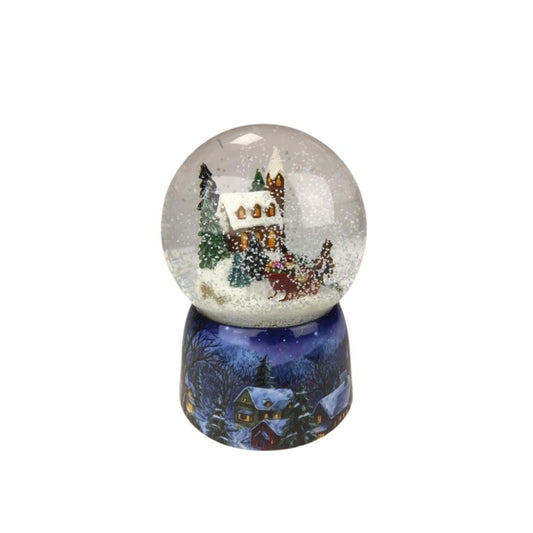 Snow globe sleigh ride. In the globe filled with snow, a couple takes a nostalgic sleigh ride past a snow-covered church surrounded by fir-trees. The base is painted with snowy village scenes. By winding the musical mechanism up, the scene starts to rotate inside the globe to the melody “Jingle Bells”.