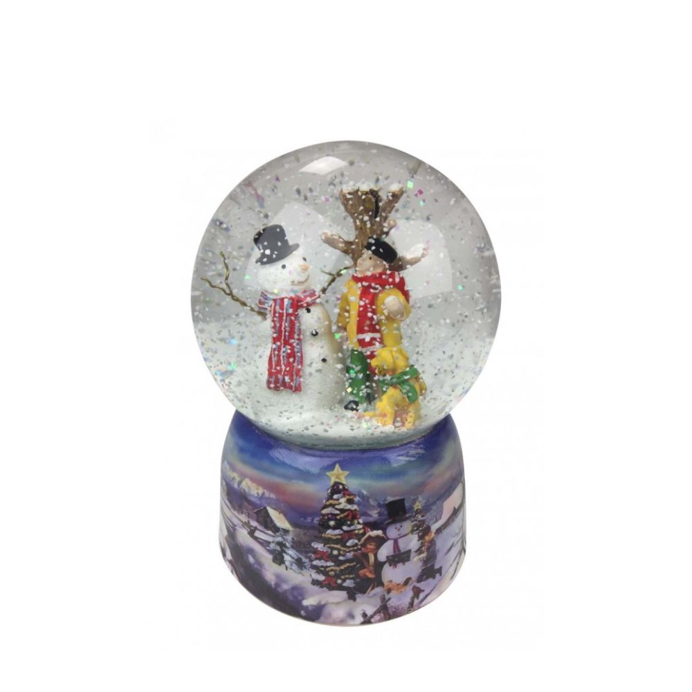 Musicbox World Snow Globe Snowman & Dog  Snow globe with snowman. In the ball filled with glitter and snow, a man stands with his dog and looks at the tall smiling snowman standing close to a tree. The base is painted with a snowy wintery village landscape. By winding up the mechanical movement with the disc, the music box turns on the disc to the melody “Silent Night”. 