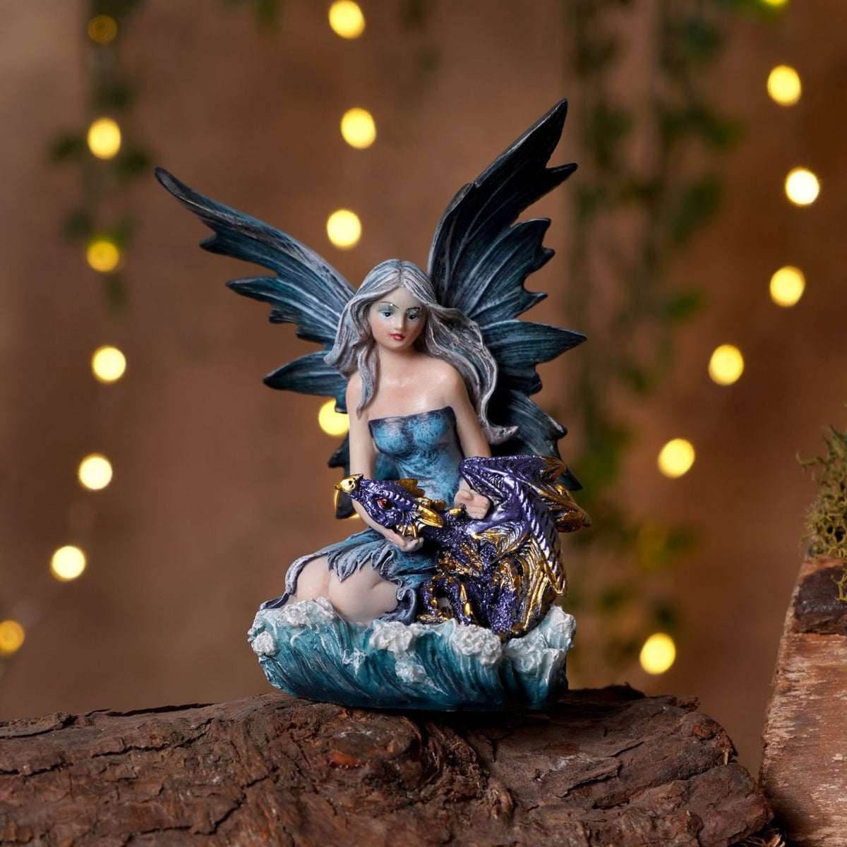 Mystic Legends Colourful Fairies set is a beautifully detailed collection of fantasy ornaments, designed to bring vibrant colour and enchanting character to any display. Each figurine features a delicately sculpted fairy seated in a unique pose, accompanied by intricately detailed dragons or elemental-inspired bases, creating a strong sense of storytelling and individuality.