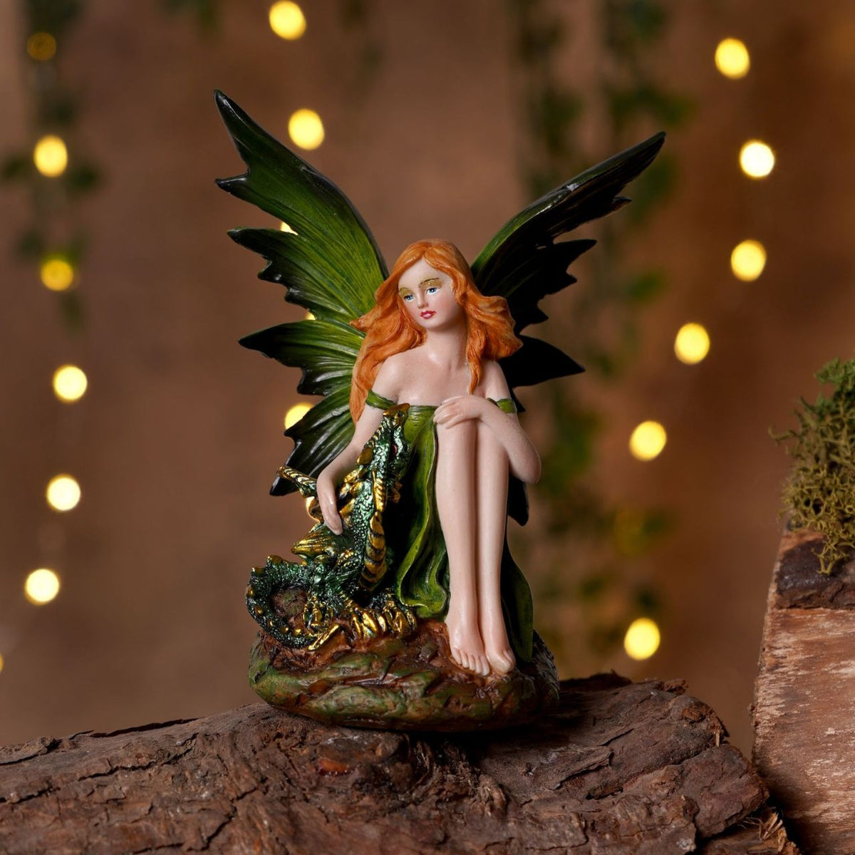 Mystic Legends Colourful Fairies set is a beautifully detailed collection of fantasy ornaments, designed to bring vibrant colour and enchanting character to any display. Each figurine features a delicately sculpted fairy seated in a unique pose, accompanied by intricately detailed dragons or elemental-inspired bases, creating a strong sense of storytelling and individuality.