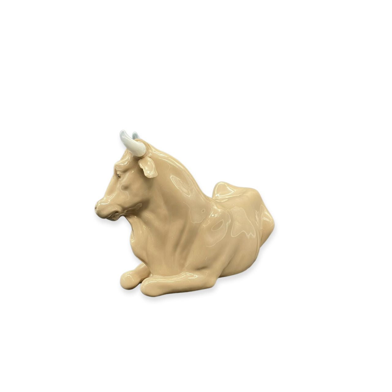 Nao by Lladro Calf  Nao porcelain figurine “Calf” from the Christmas Collection.  Sculpted by Salvador Furió, this figurine is part of the nativity set. 
