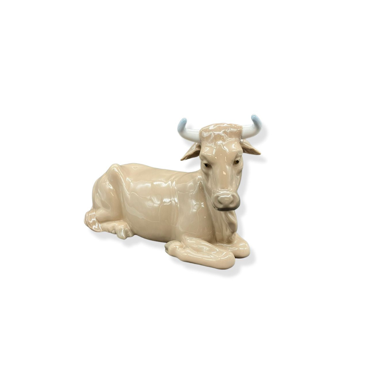 Nao by Lladro Calf  Nao porcelain figurine “Calf” from the Christmas Collection.  Sculpted by Salvador Furió, this figurine is part of the nativity set. 