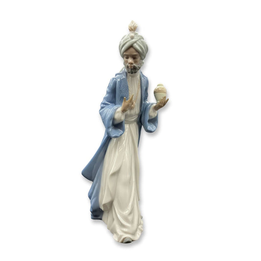 Nao by Lladro King Balthasar with Jug Wisemen  Nao porcelain figurine “King Balthasar with Jug” from the Christmas Collection.  Sculpted by Regino Torrijos, this figurine is part of the nativity set.