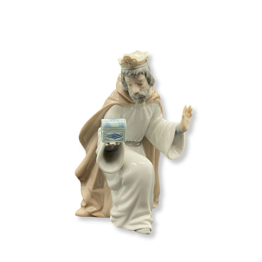Nao by Lladro King Melchior With Chest Wisemen  Nao porcelain figurine “King Melchior With Chest” from the Christmas Collection.  Sculpted by Regino Torrijos, this figurine is part of the nativity set.