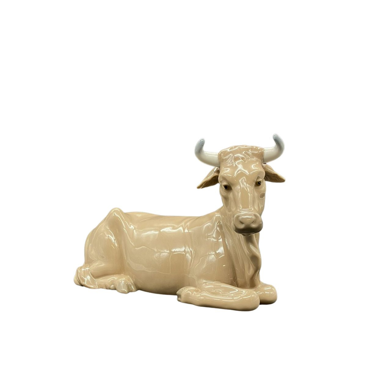 Nao by Lladro Calf  Nao porcelain figurine “Calf” from the Christmas Collection.  Sculpted by Salvador Furió, this figurine is part of the nativity set. 