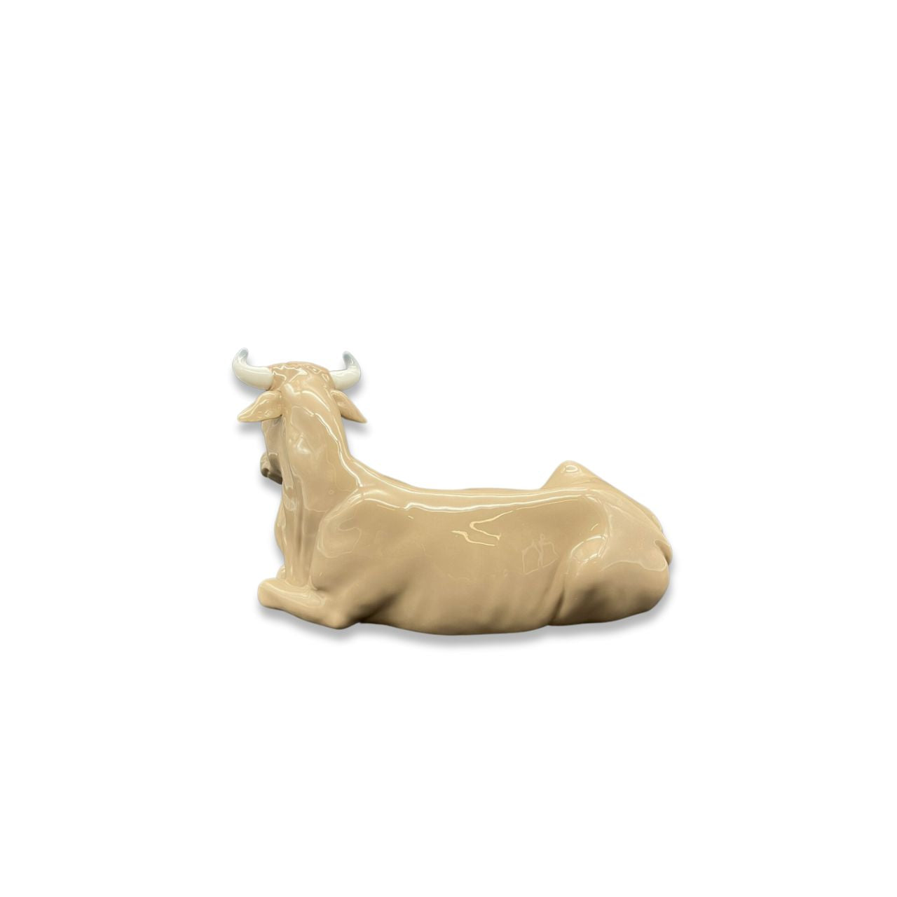 Nao by Lladro Calf  Nao porcelain figurine “Calf” from the Christmas Collection.  Sculpted by Salvador Furió, this figurine is part of the nativity set. 