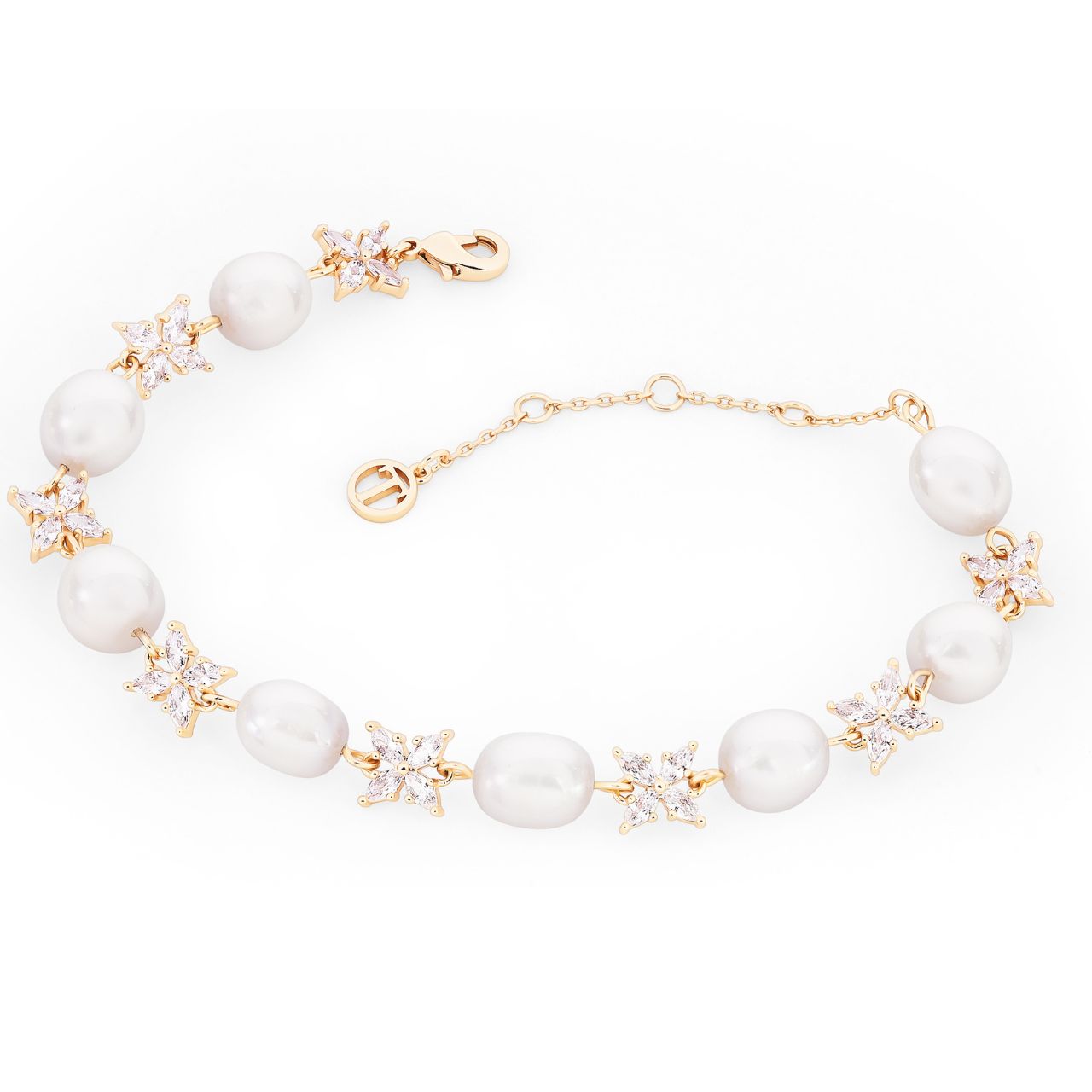 Introducing the sophisticated Gold Natural Pearl &amp; CZ Bracelet by Tipperary. Made with genuine pearls and sparkling cubic zirconia, this elegant piece will elevate any outfit. Expertly crafted with a timeless design, this bracelet is perfect for adding a touch of luxury and glamour to your style.