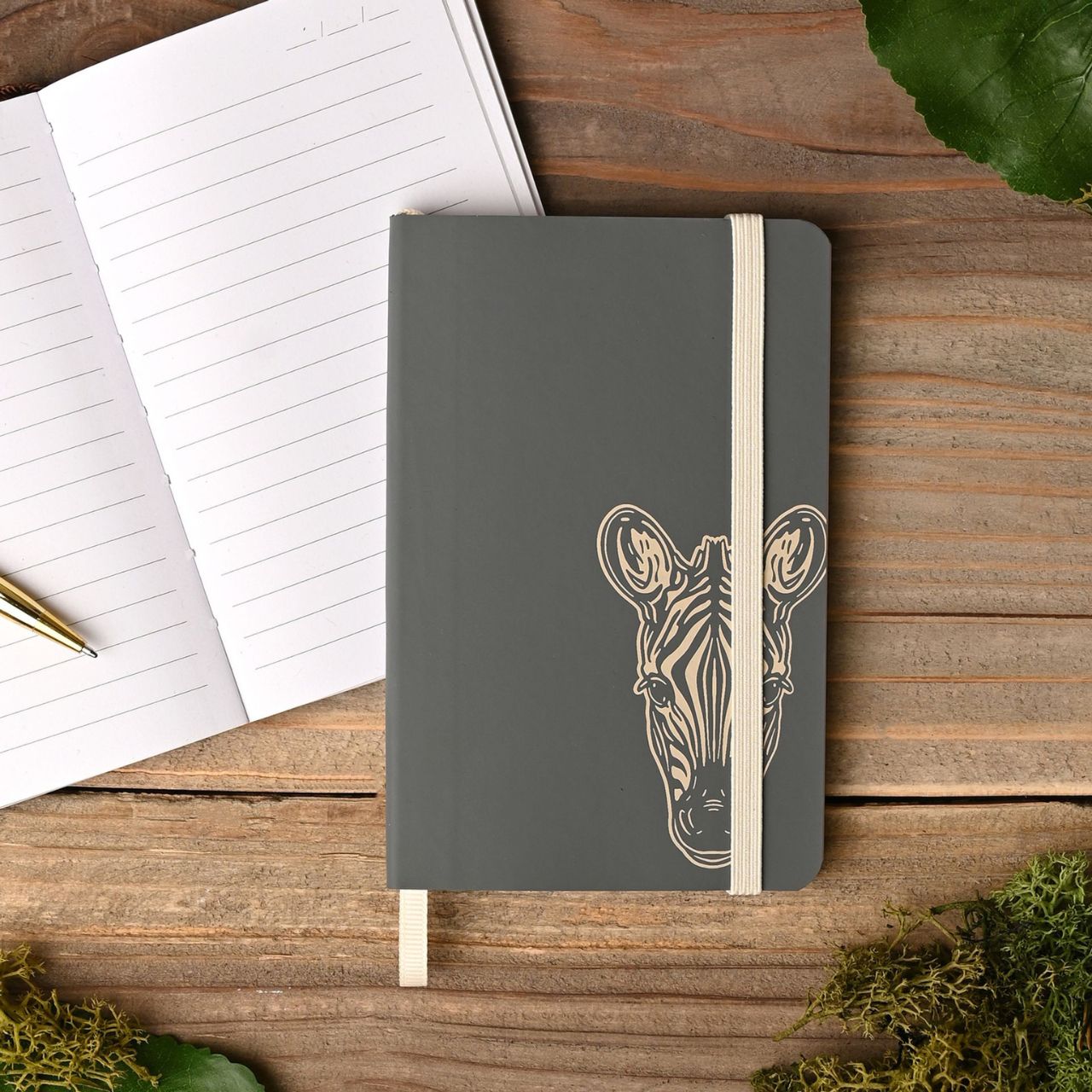 The Naturecraft Zebra Recycled PU Notebook Slate is a charming notebook is perfect for jotting down thoughts, ideas, and dreams.