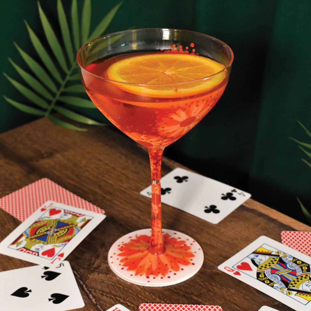 Celebrate Lolita's anniversary with our Negroni Cocktail Glass. A beautiful reminder of how Lolita first started Designs by Lolita with this design. This particular fun design is surrounded speckles or pinks and oranges with florals around the rim to the base, the perfect glass for spring/summer.