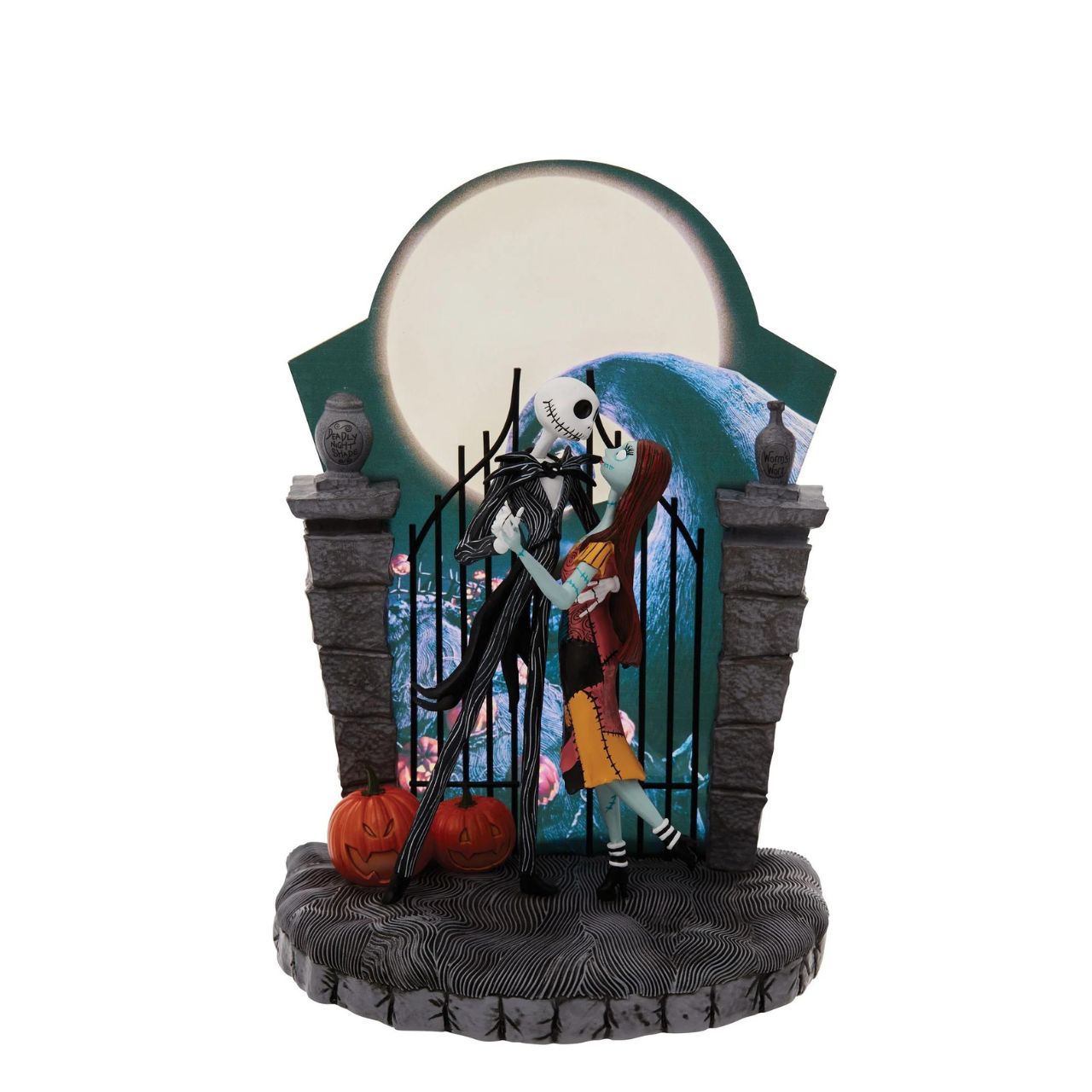 Nightmare Before Christmas Figurine  A lit up Halloween moon forms the back drop of this endearing scene from The Nightmare Before Christmas. Jack and Sally's graveyard waltz is frozen in time with only jack-o-lanterns as their witnesses.