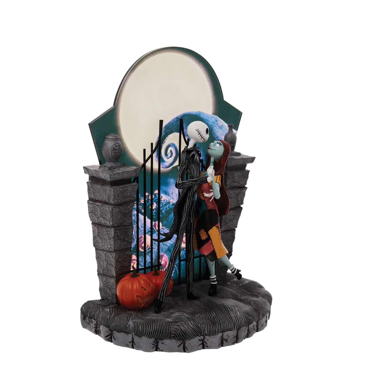 Nightmare Before Christmas Figurine  A lit up Halloween moon forms the back drop of this endearing scene from The Nightmare Before Christmas. Jack and Sally's graveyard waltz is frozen in time with only jack-o-lanterns as their witnesses.