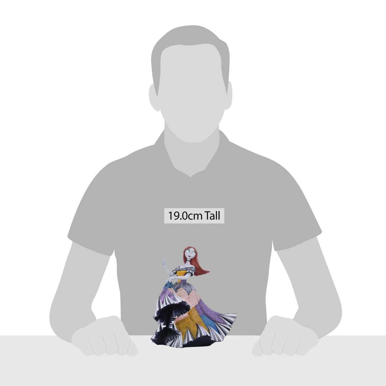 Disney Showcase Nightmare Before Christmas Sally Figurine  Sally from Tim Burton's The Nightmare Before Christmas has updated her rag doll dress into a stunning gown for the Halloween Ball. Hand painted by skilled artisans, Sally shines with iridescent paint and faux gem stones.