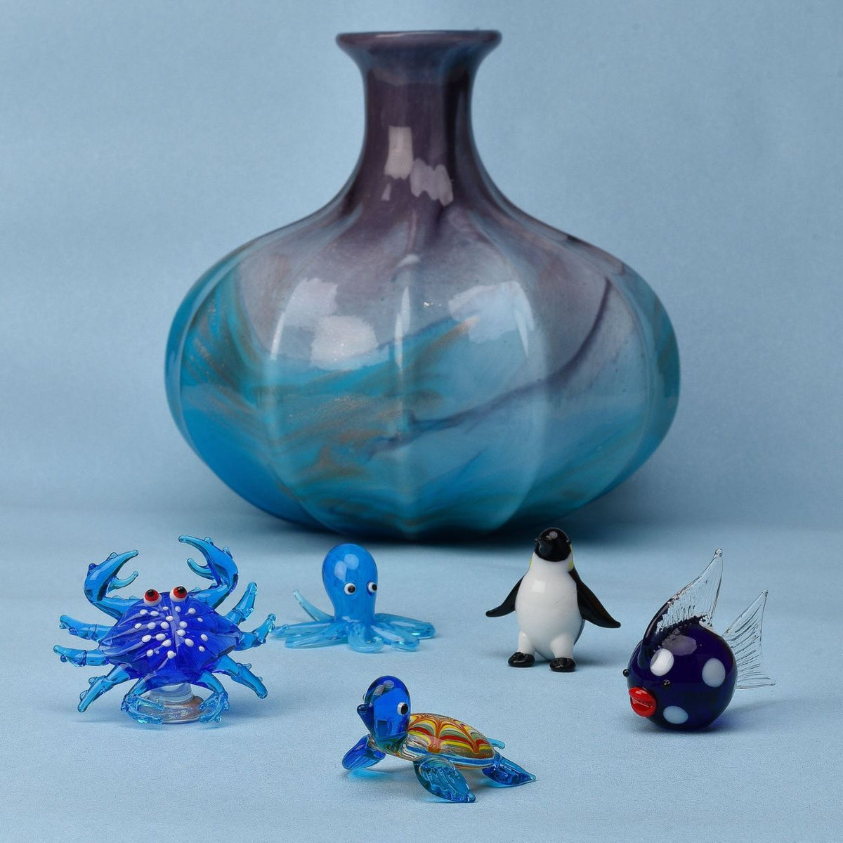 A beautifully elegant handmade glass ornament. From Objets d'Art by SOPHIA - hand blown