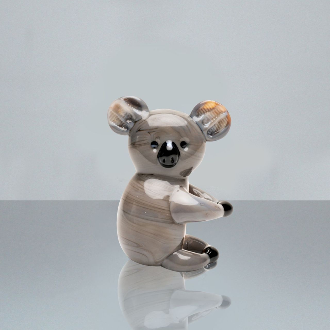 A beautiful stylised handmade coloured glass Koala Bear ornament. From Objets d'Art by SOPHIA - hand blown and one hundred percent unique.
