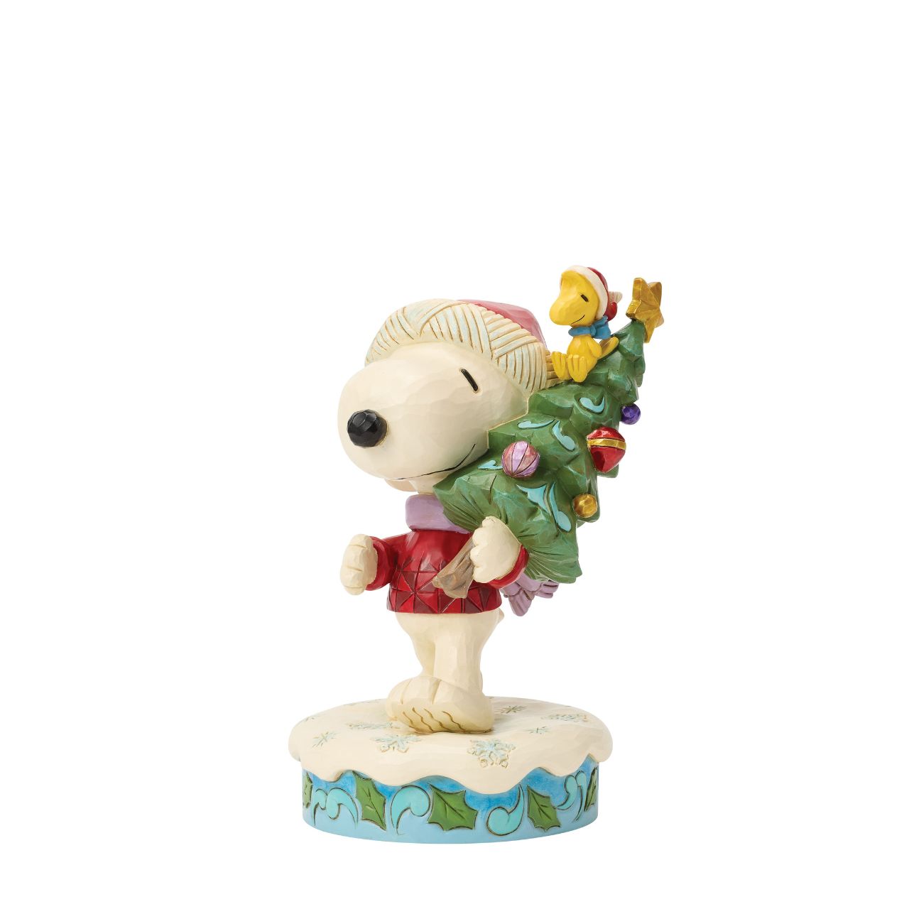 Snoopy and Woodstock bring home a decorated Christmas tree in this heart warming Jim Shore scene. With festive folk art touches, it's a charming reminder of holiday traditions and lifelong friendship. Celebrate the season with your favourite Peanuts.