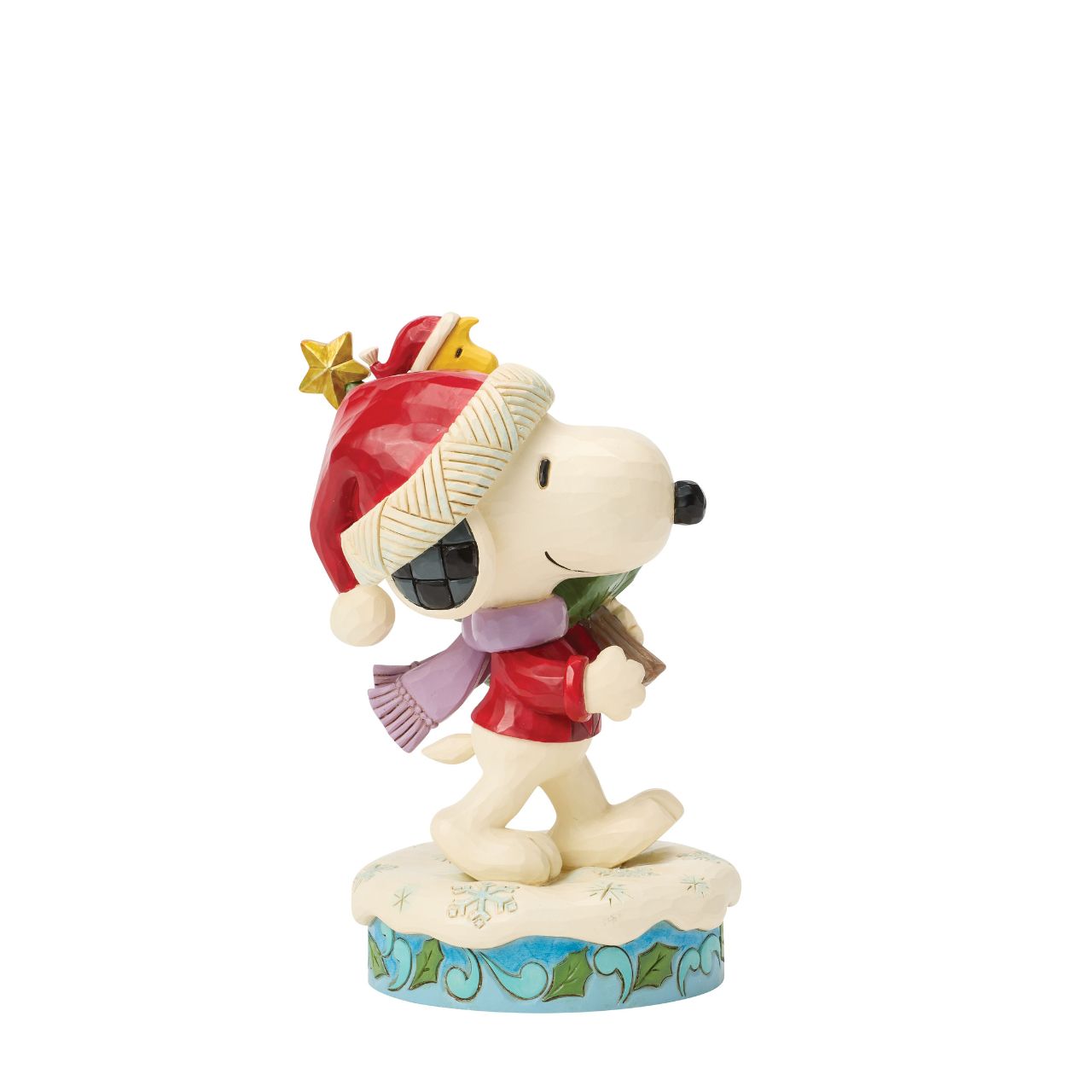 Snoopy and Woodstock bring home a decorated Christmas tree in this heart warming Jim Shore scene. With festive folk art touches, it's a charming reminder of holiday traditions and lifelong friendship. Celebrate the season with your favourite Peanuts.