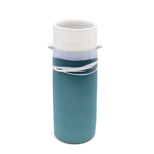 Tipperary Crystal Paul Maloney Pottery Large Cylinder Vase  This authentic Paul Maloney Pottery Teal Large Cylinder Vase will make a bold statement in your space. Crafted from high-quality clay, this eye-catching piece features a distinctive teal colour that will instantly elevate any room. Place it anywhere in your home for an instant touch of style.