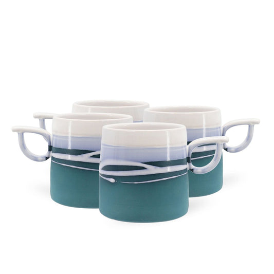 Tipperary Crystal Paul Maloney Pottery Teal S/4 Mugs  This Paul Maloney Pottery Teal set of Mugs is the perfect way to enjoy your favourite hot beverage. Crafted by renowned potter Paul Maloney, this mug is made of durable and long-lasting clay, with a glazed teal finish that is sure to impress. Ideal for all kinds of hot drinks, this mug is sure to bring elegance to your morning routine.