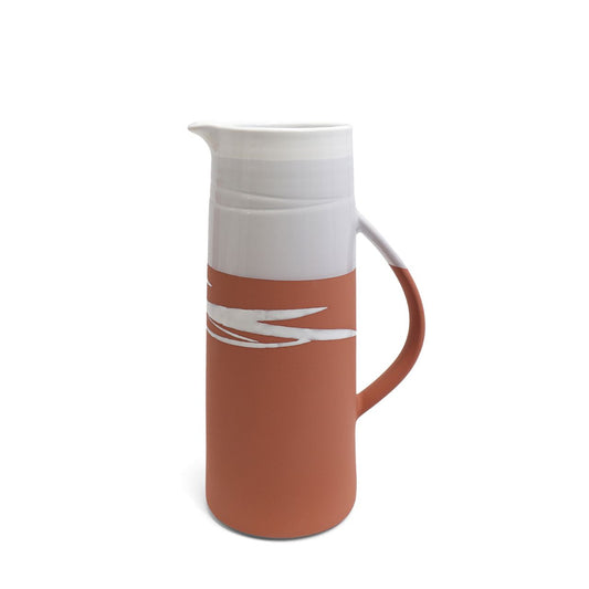 This stunning Paul Maloney Pottery Terracotta Large Jug is handmade with care. The simple, clean design features a high-quality stoneware with a Terracotta glaze, making it a perfect decorative piece. It is perfect for serving drinks or filling with flowers.